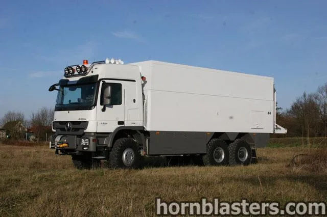 Side profile or cab-level view of Ritter's 2010 Mercedes-Benz Actros 6x with Nathan AirChime K5LA train horn install context, HornBlasters gallery photo 2
