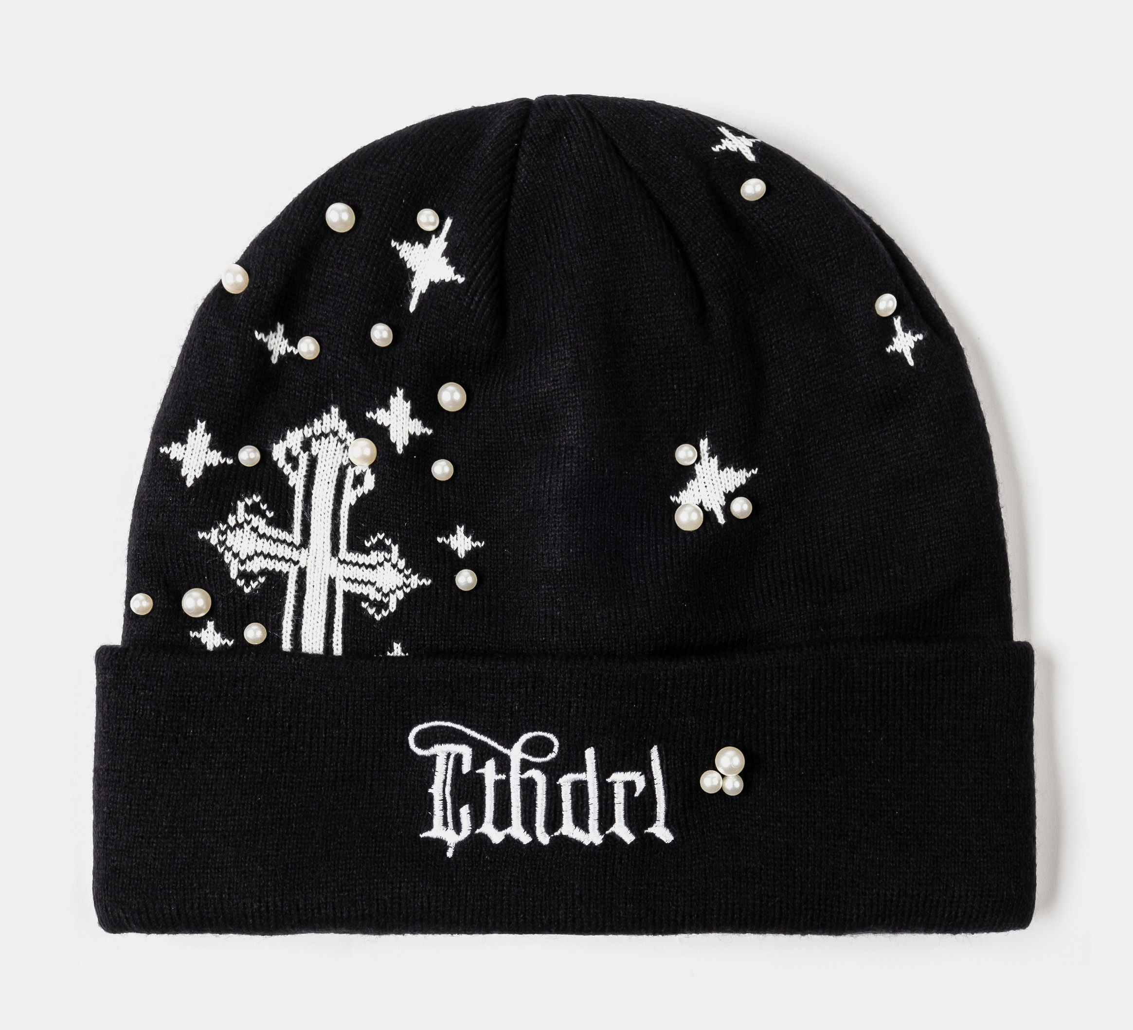 Black beanie with white cross, stars, and decorative pearls.