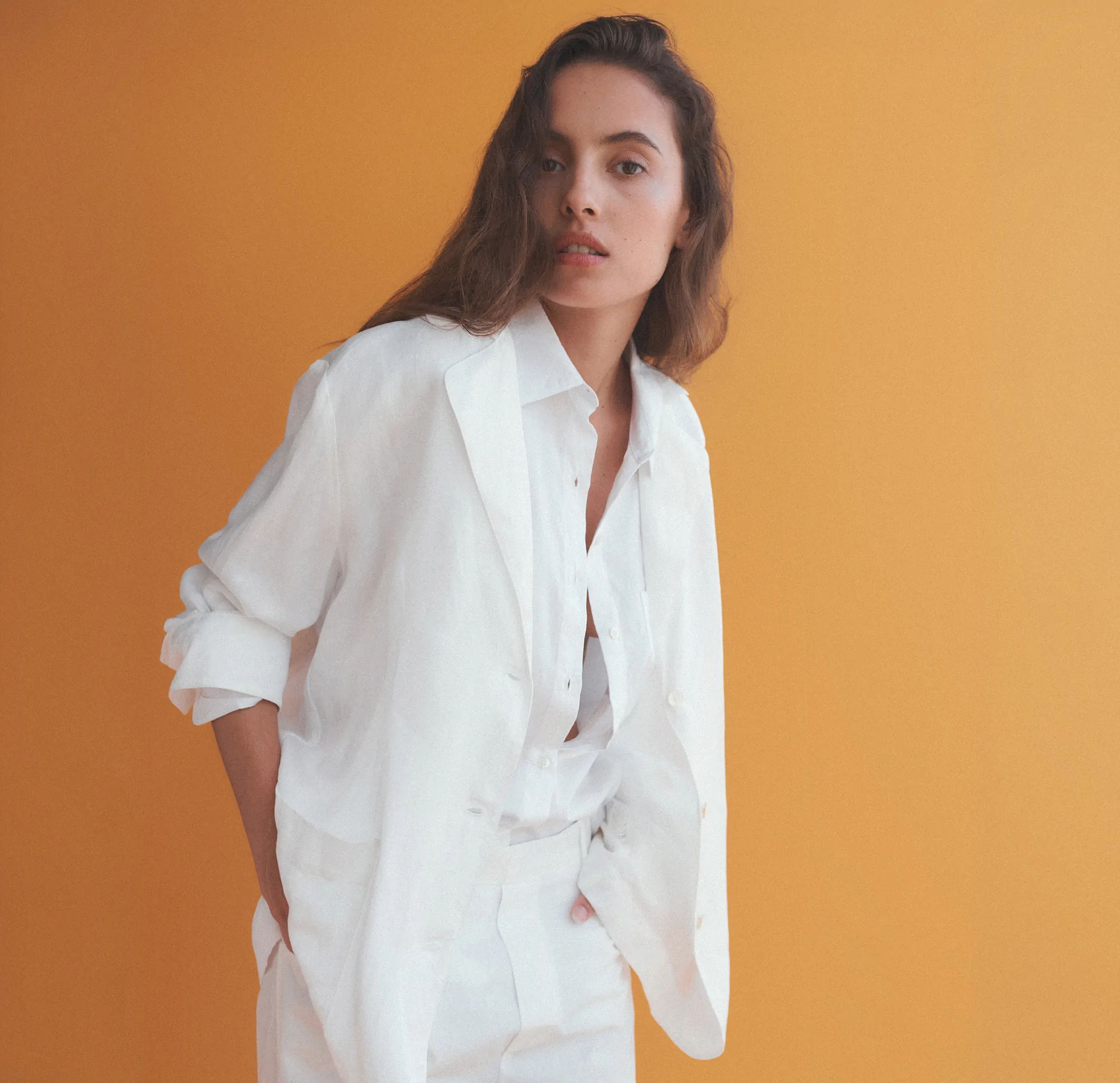Woman with hands in pockets