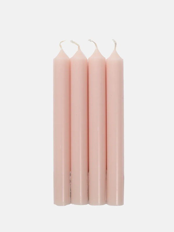 Four pink taper candles arranged vertically.
