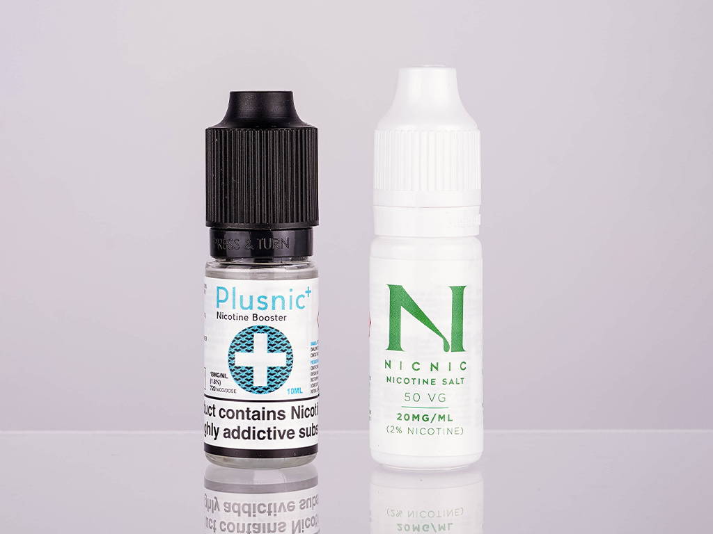 A photo showing two bottles of 10ml nicotine shots.