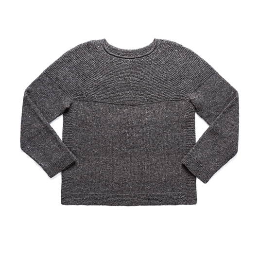 A hand knit textured yoke pullover photographed flat on a white background 