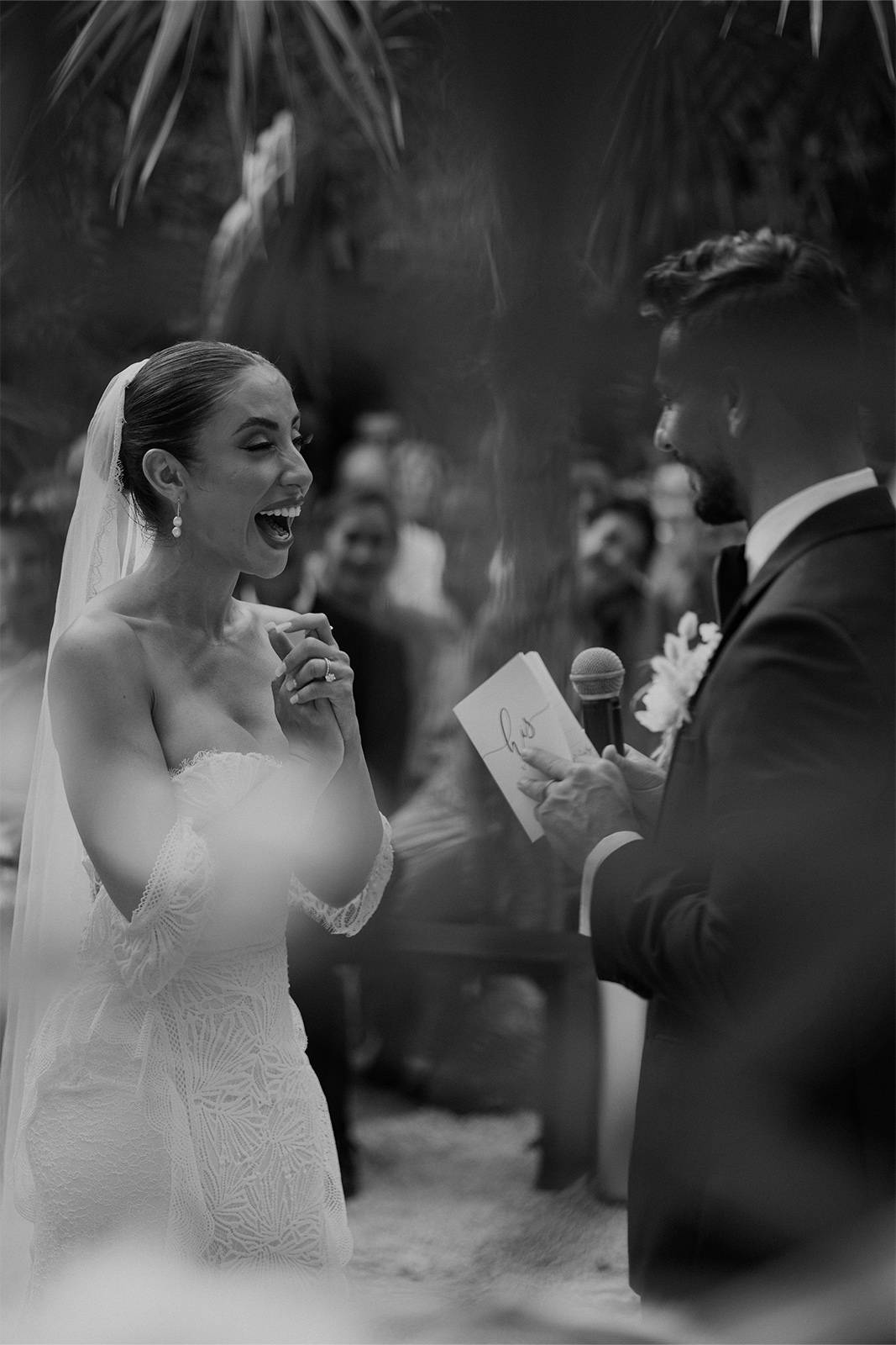 Bride laughing at the groom's vows