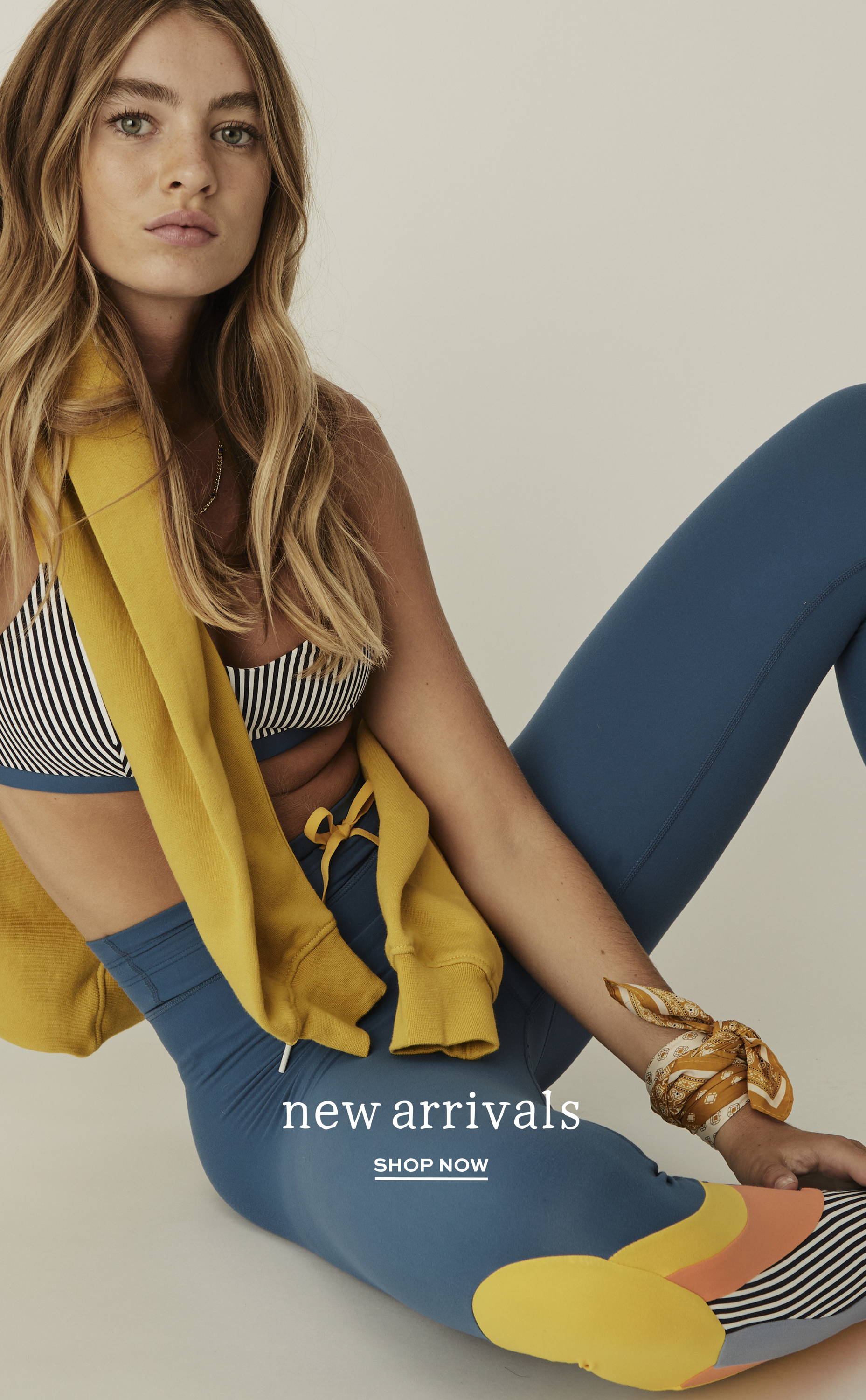 THE UPSIDE new arrivals. Shop now. Model wears the blue Rise 25in Midi Pant, stripe Rise Ballet Bra and yellow Saturn Crew.