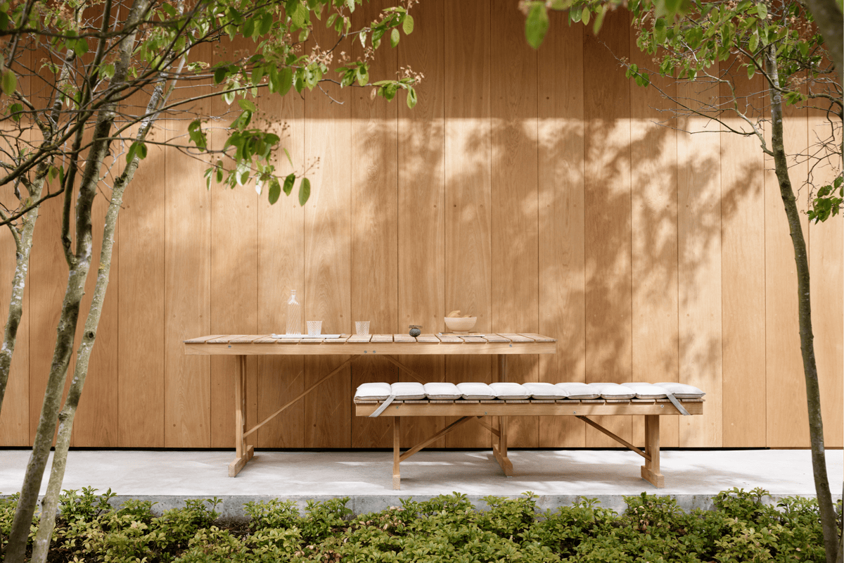 Boxhill's BM Teak Outdoor Foldable Table and Bench inspired by vintage Danish designs.