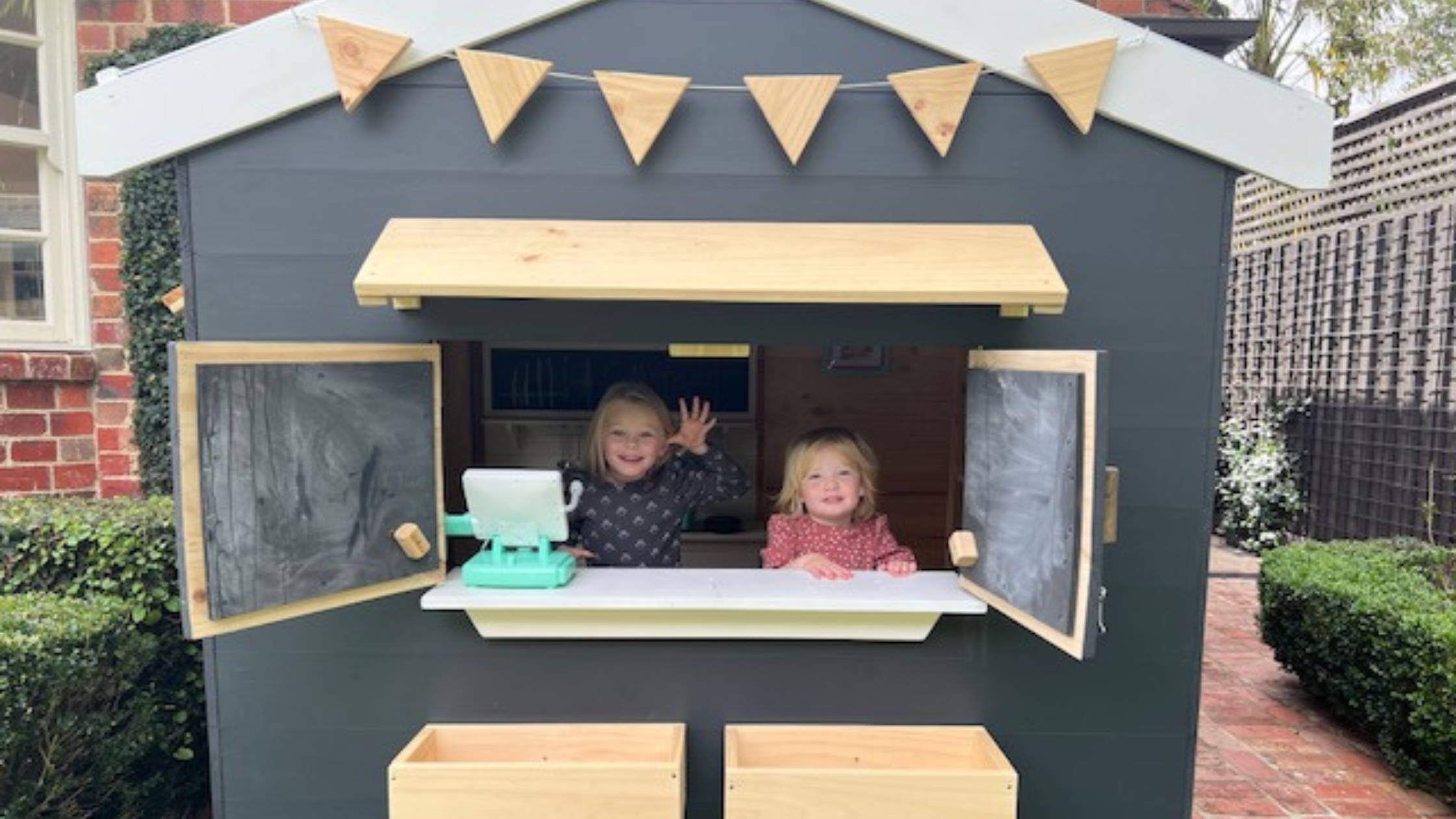 Jack and Carly Riewoldt's kids play in their wooden Cubby House