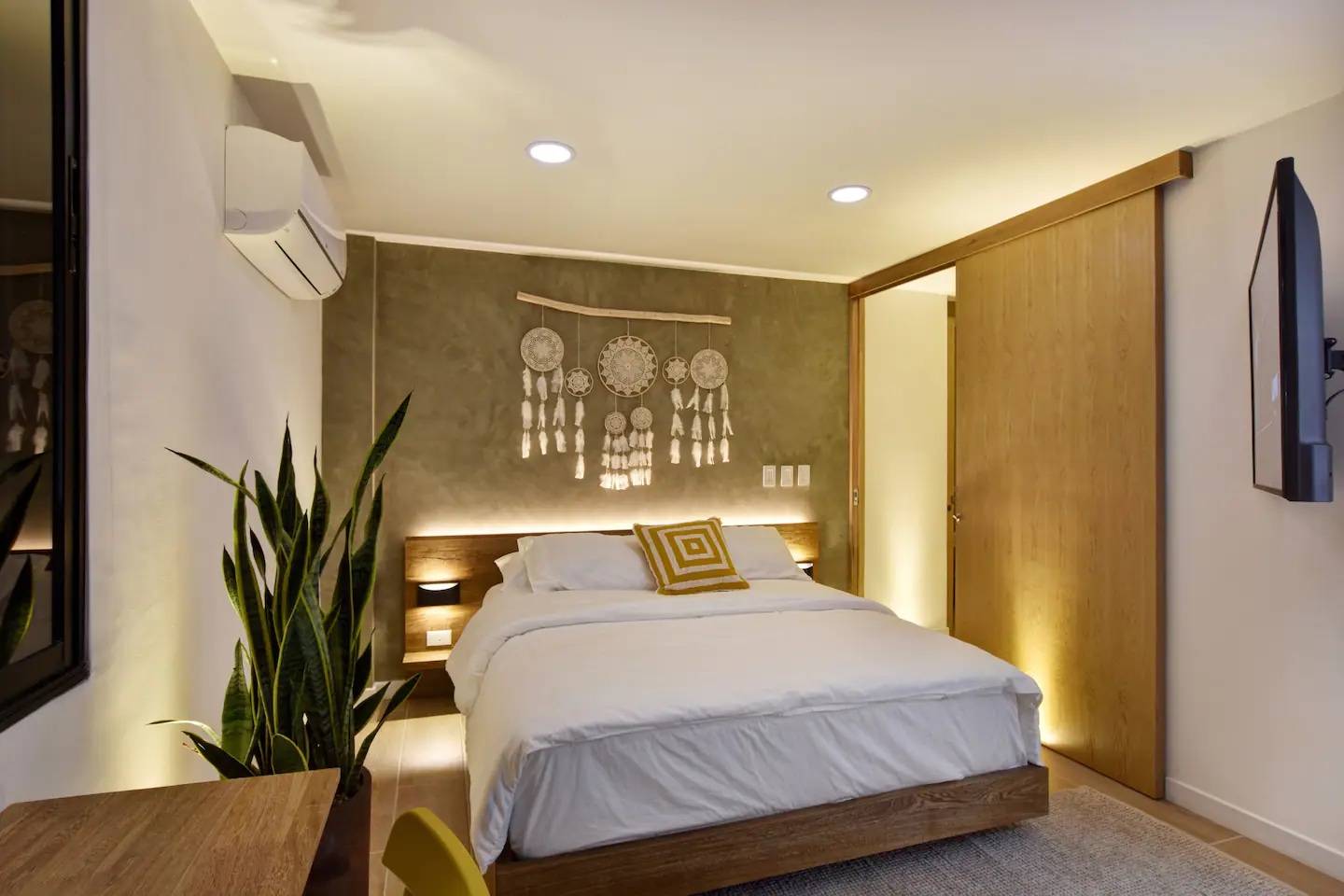Modern bedroom decor with backlit headboard using LED strip lights