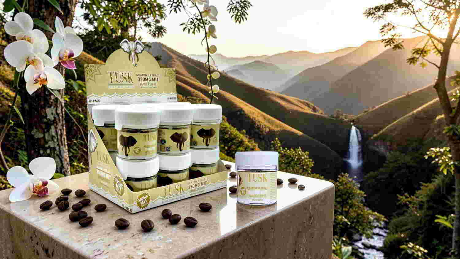 Skincare products displayed outdoors with mountains and a waterfall in the background.