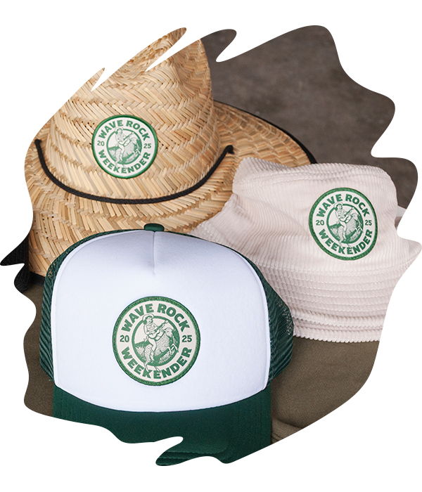 White and green foam trucker cap, straw hat, and pink bucket hat with circular woven 'Wave Rock Weekender' patches on the front