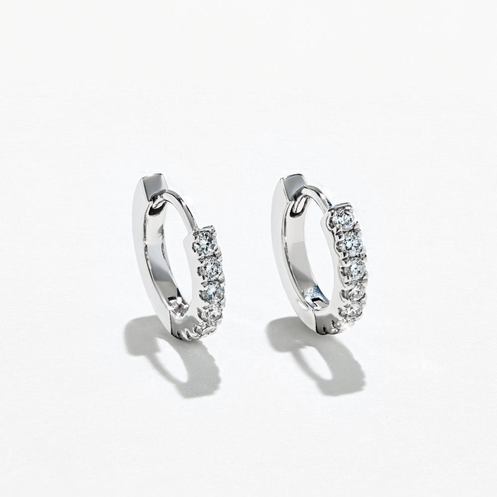 beautiful diamond huggie earrings in white gold