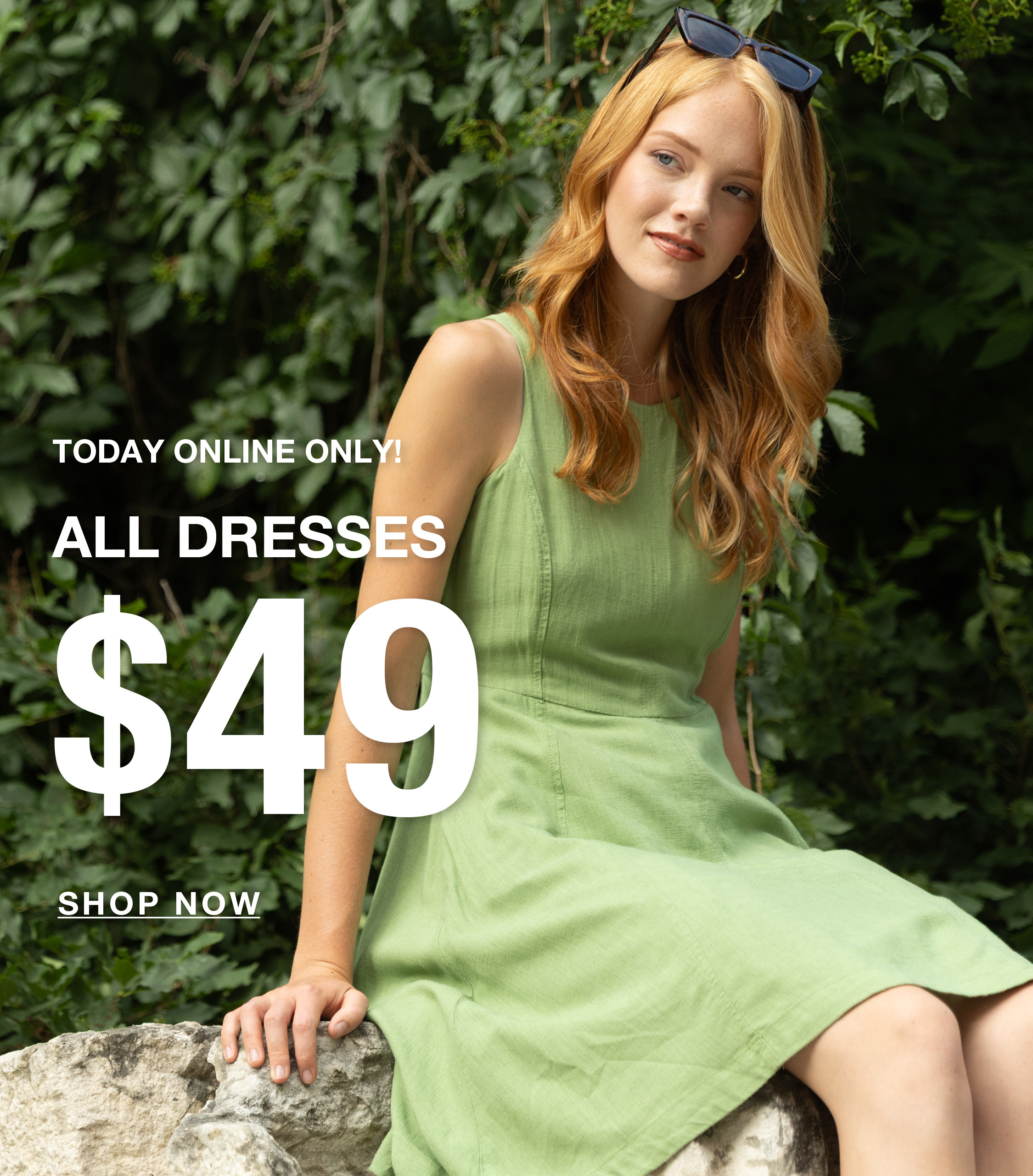 Model in a green dress promoting $49 dresses, surrounded by greenery.