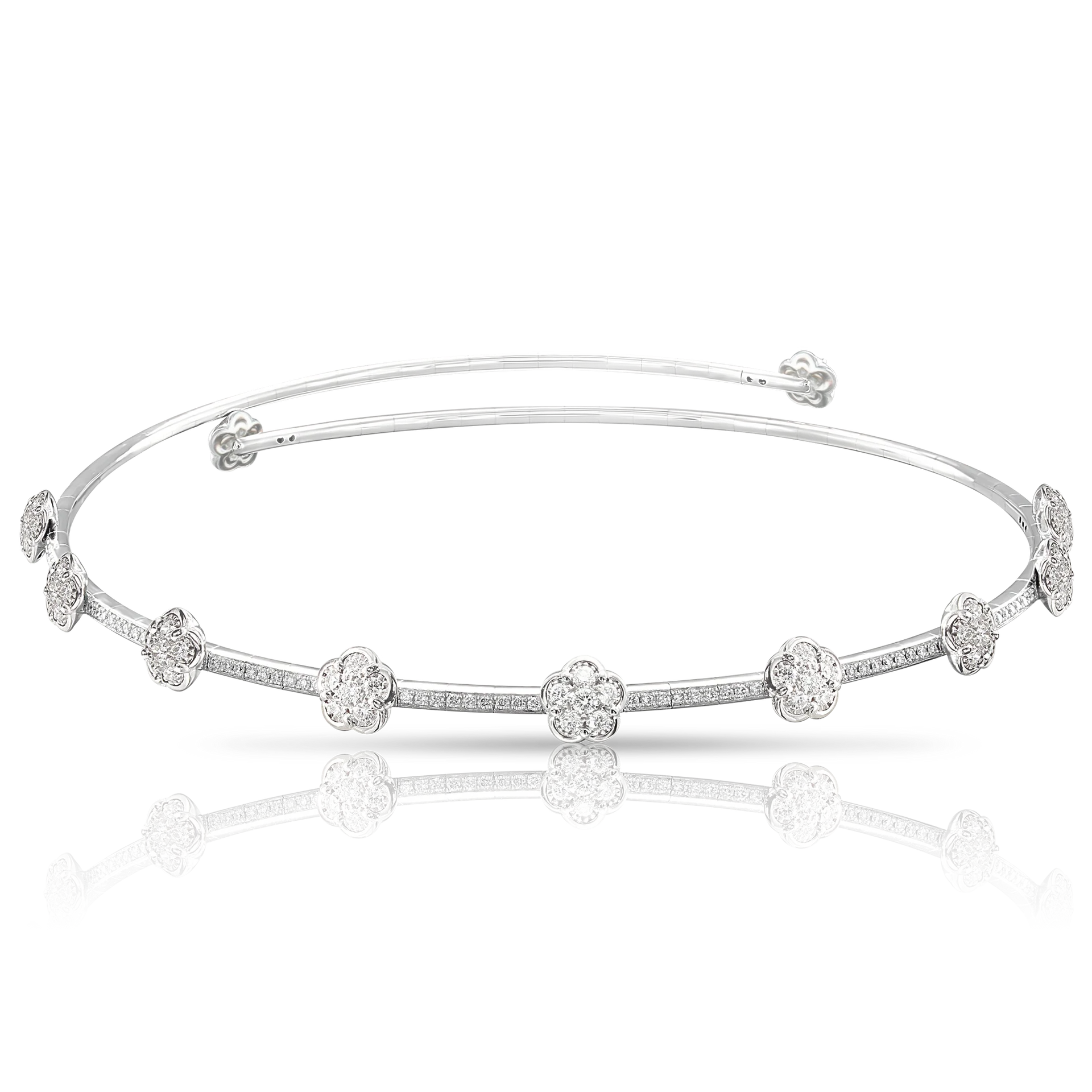 18k white gold choker with flower designs and diamonds, reflecting a polished surface.