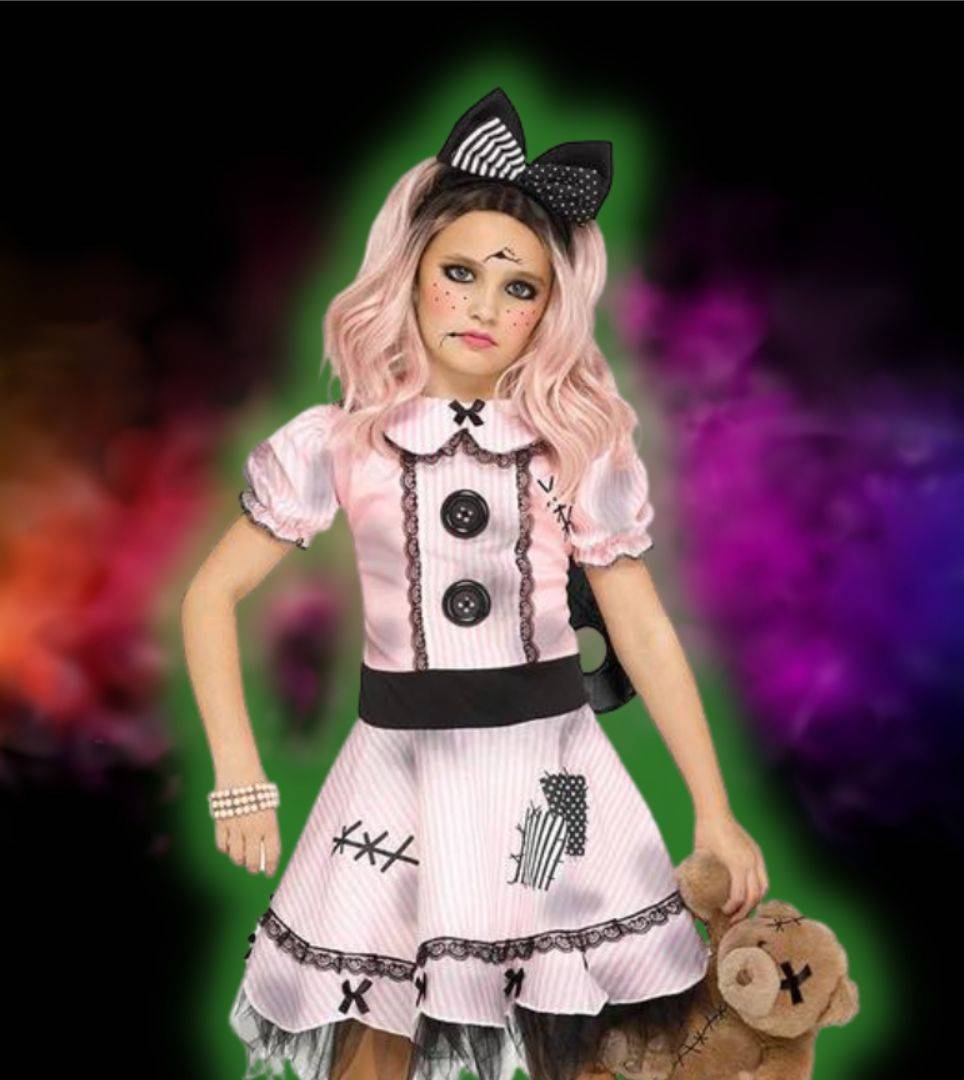 Girl in pink and black doll costume holding a teddy bear. Shop all doll costumes.