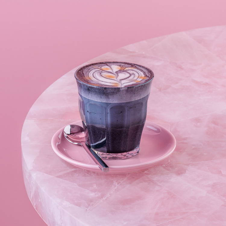 Black Charcoal Cafe Latte in pink background