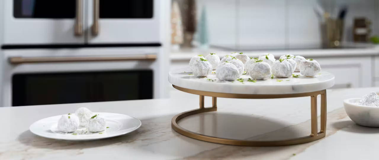 coconut lime snowball cookies in white kitchen