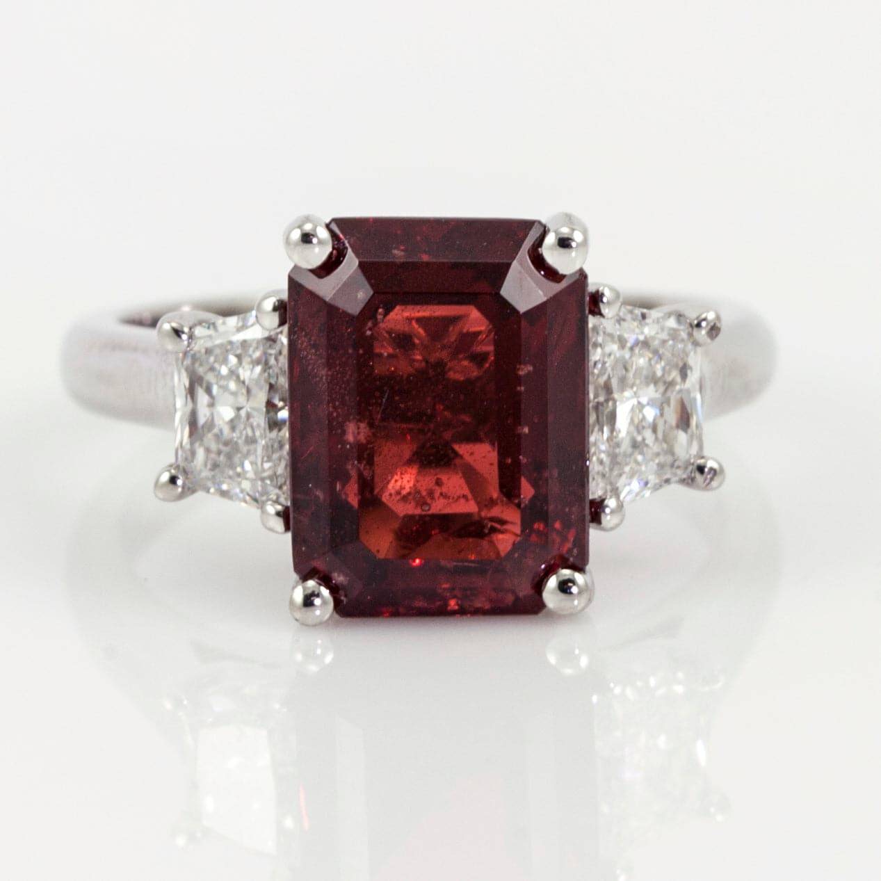 red spinel and diamond three stone ring