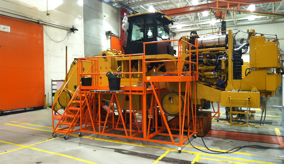 Custom mobile maintenance platform designed for servicing bulldozers and heavy earthmoving equipment during inspection and repair