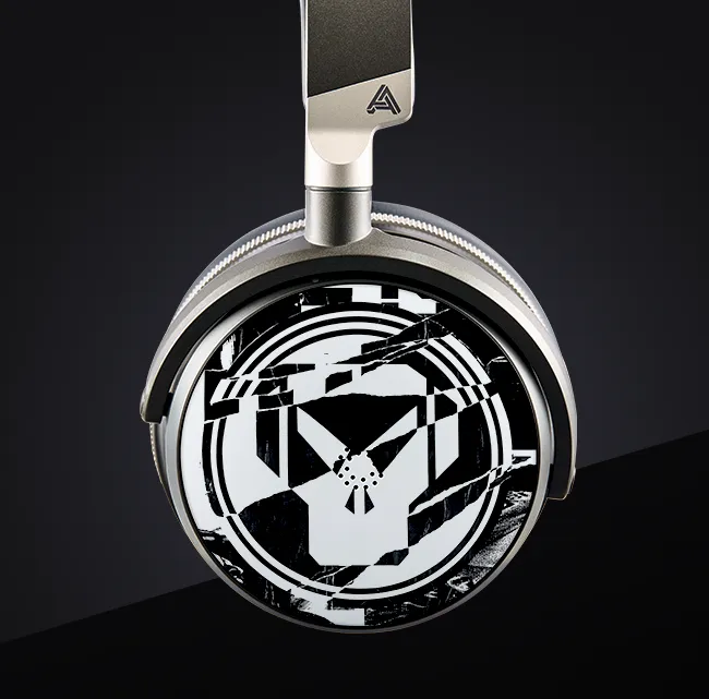 Stylish headphones with a reflective, geometric design on the ear cup.