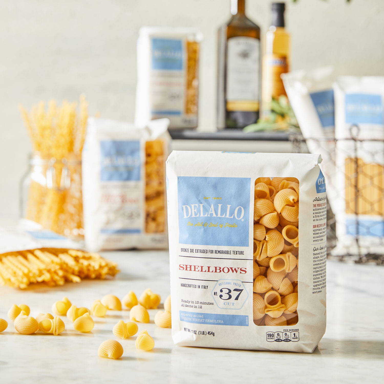 Assorted DeLallo Semolina pasta products arranged on a marble table