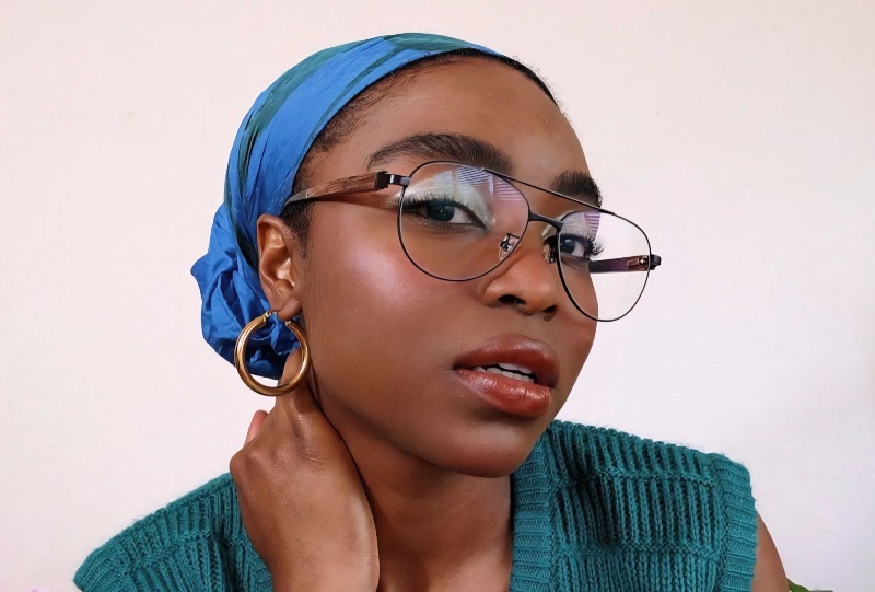 woman with lower nose bridge wearing Purpose Black eyeglasses