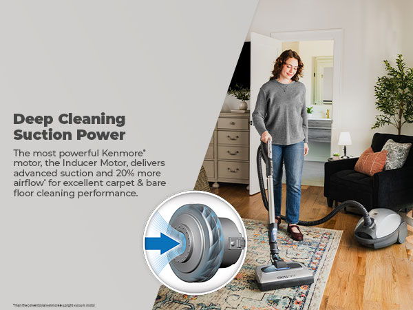 Woman vacuuming a carpet in a home setting with a powerful vacuum cleaner.