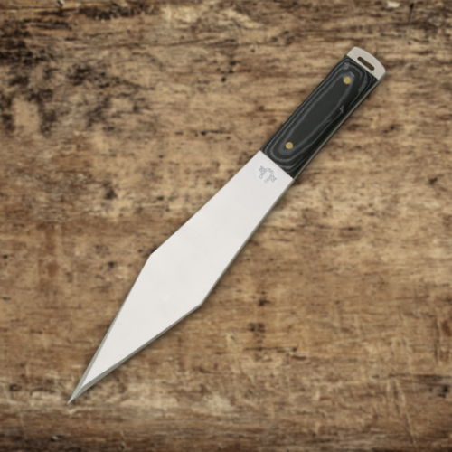 A sharp, pointed knife with a black handle on a wooden surface.