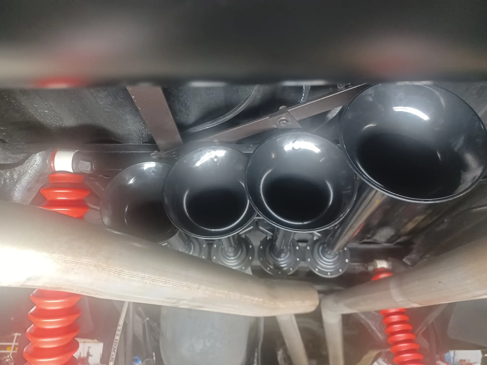 Four black Shocker XL train horns mounted on Brenda's Ford Ranger undercarriage photo 3