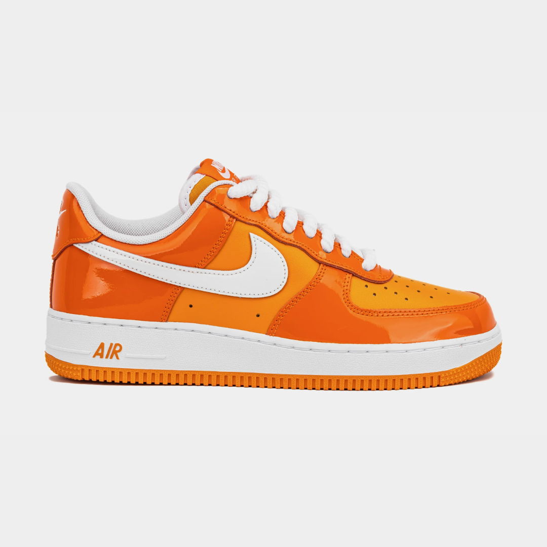Orange Nike Air Force 1 sneakers with white accents.