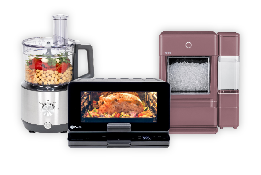 Kitchen appliances including a food processor, microwave, and refrigerator.