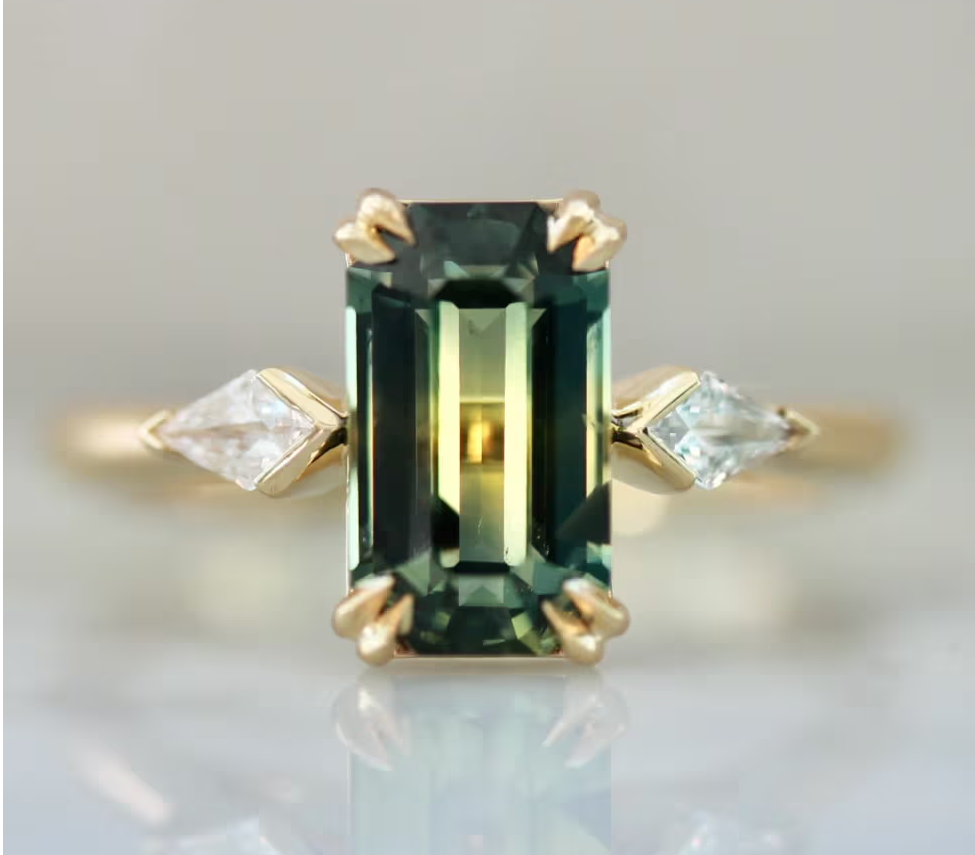 emerald cut green sapphire engagement ring