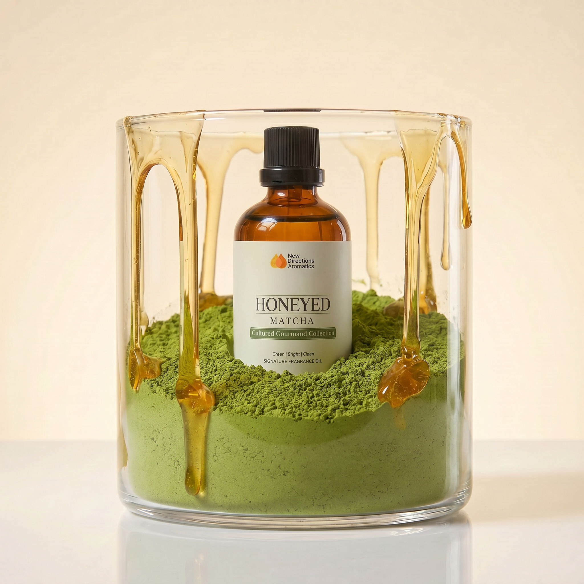 Bottle of oil surrounded by green powder and honey in a glass container.