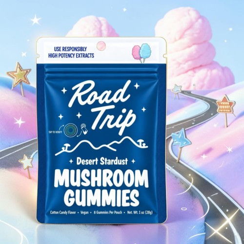 Packaging for Road Trip Desert Stardust Mushroom Gummies against a whimsical background.