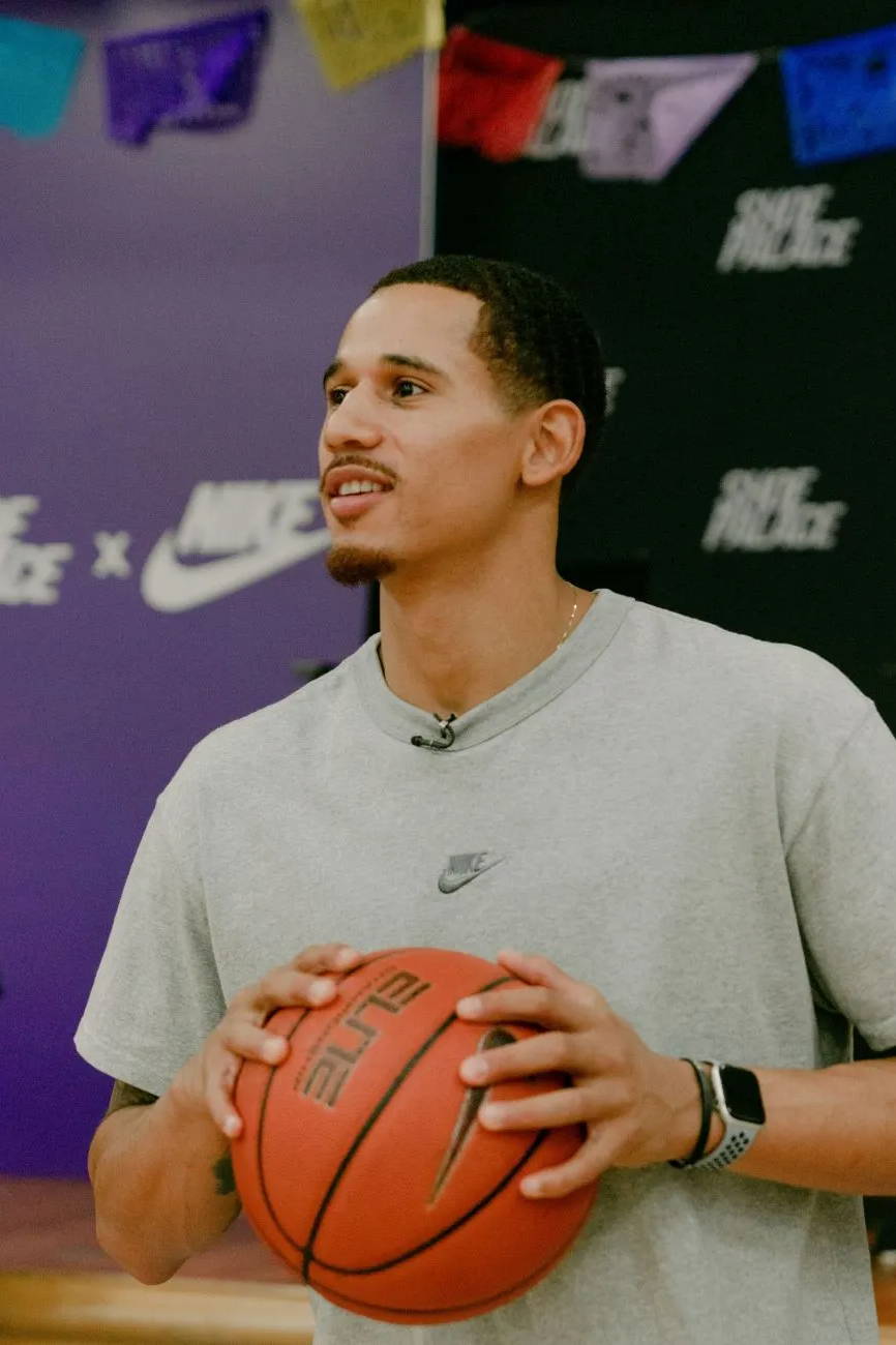 juan toscano holding a basketball