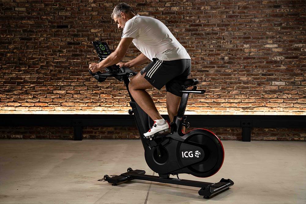 Man pedaling on IC5 Indoor Cycle in aparmtnet