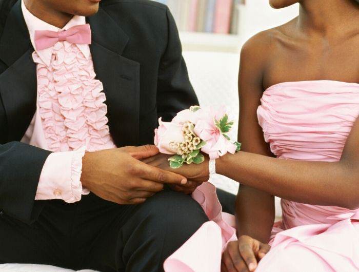 Couple dressed in pink for prom