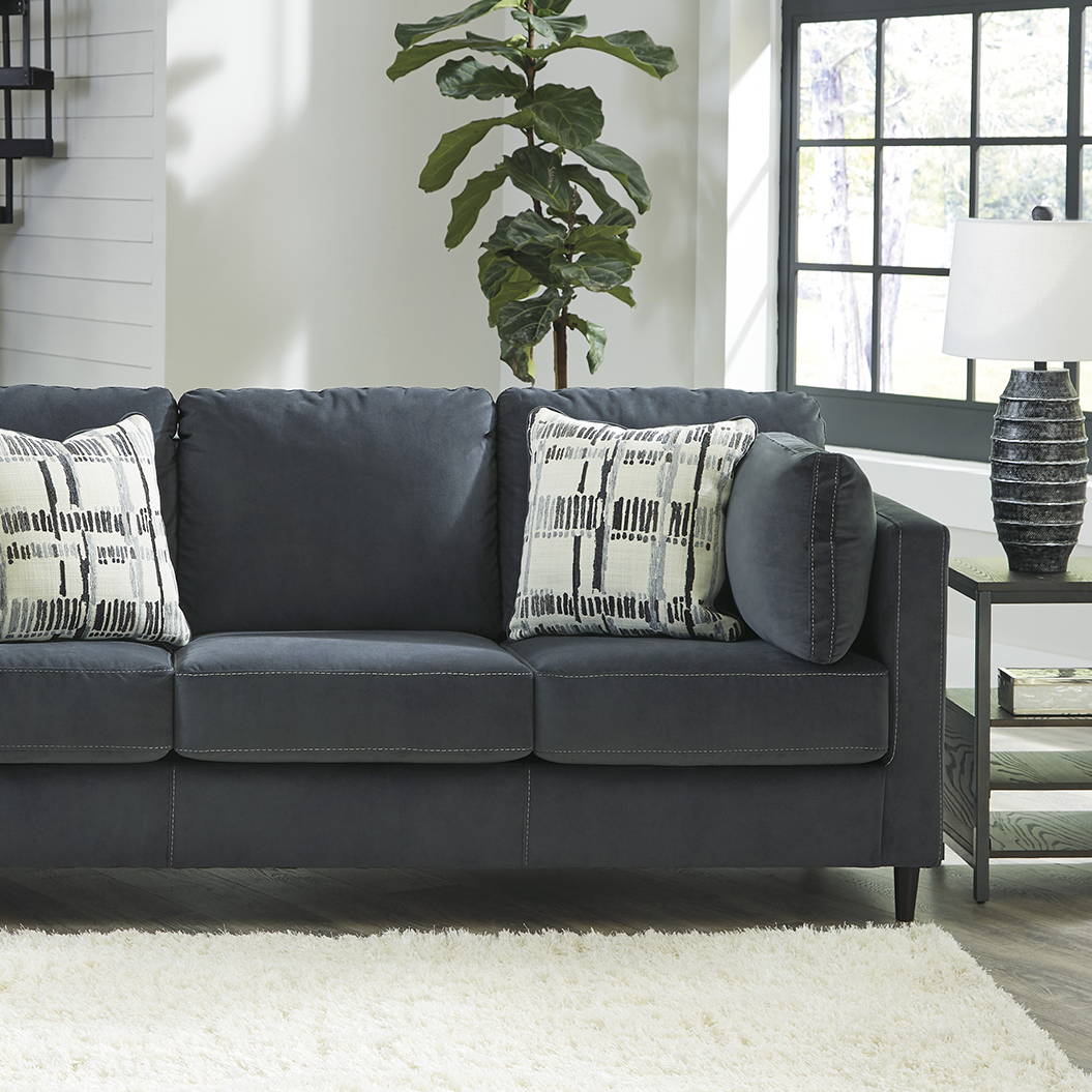 Ashley Black Sofa Set with Pillows in a Living Room. Shop Sofas Now
