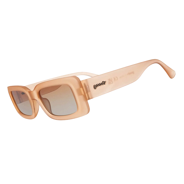 A pair of stylish light-colored sunglasses with a square frame.