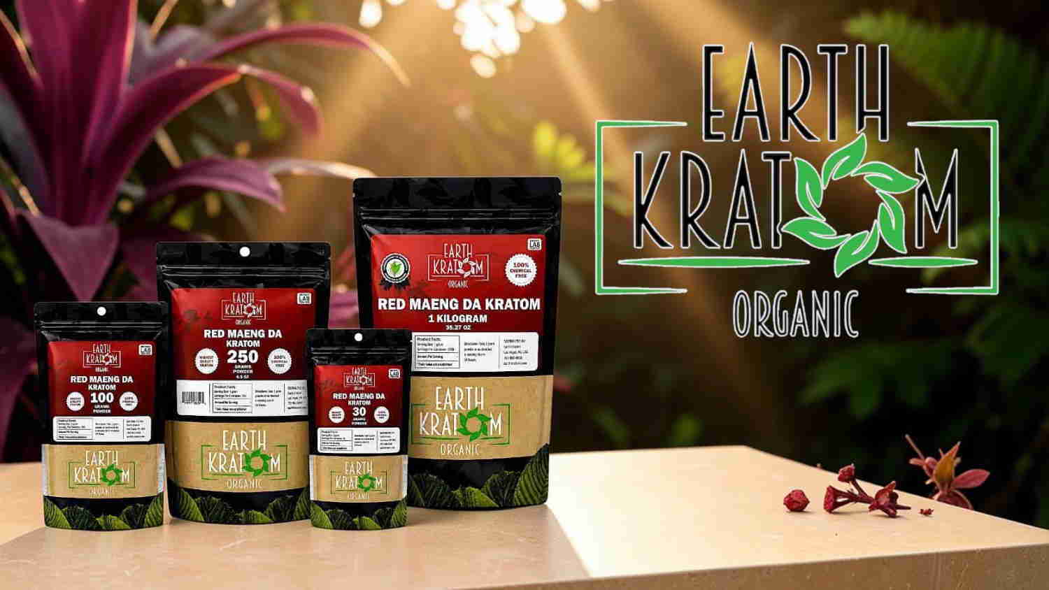 Bags of organic kratom products displayed on a wooden surface with plants.