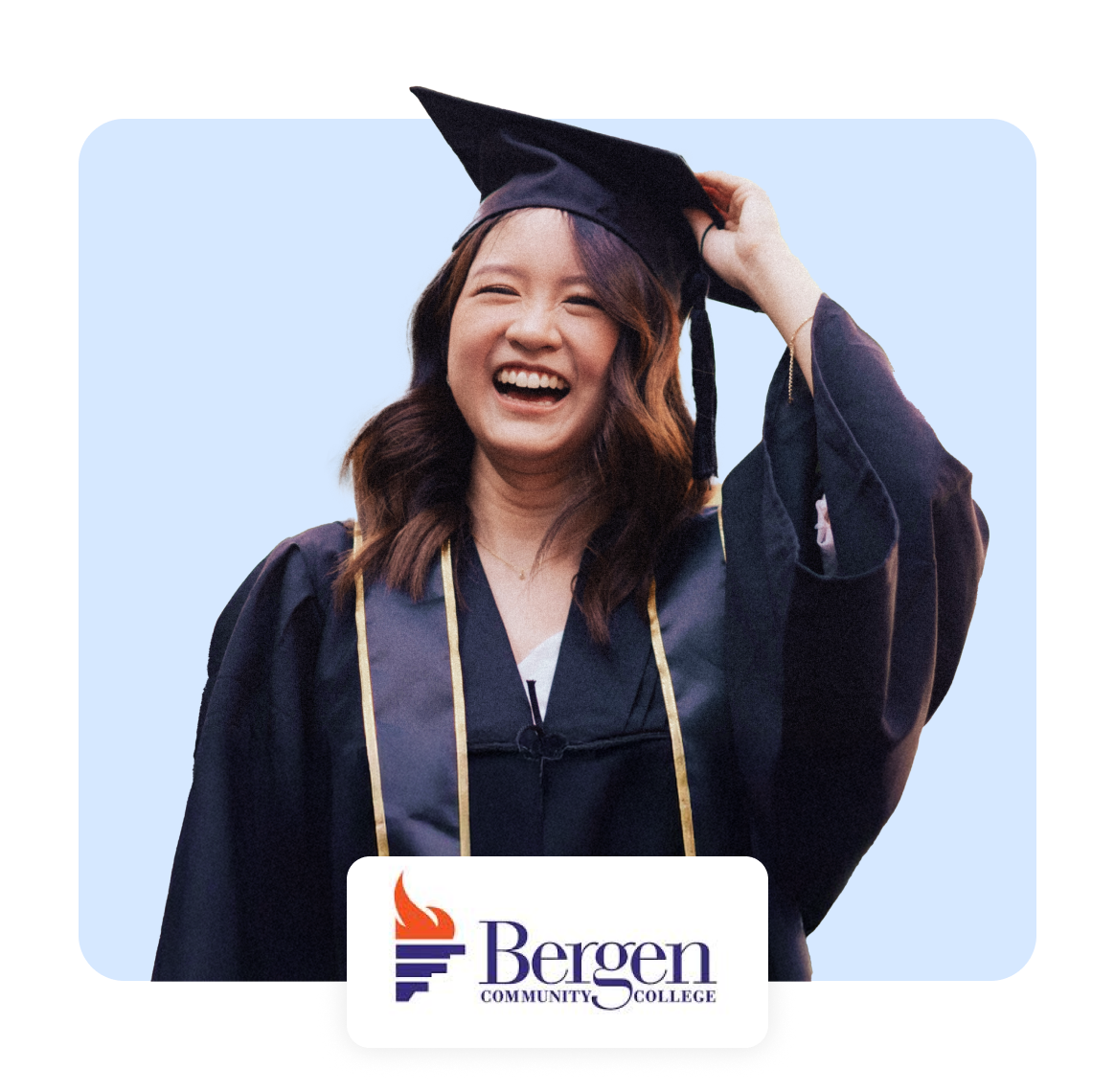 Happy graduate wearing a cap and gown, celebrating achievement with a smile.
