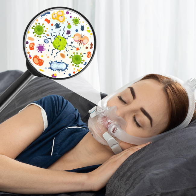 Person sleeping with a CPAP mask, surrounded by colorful germs illustration.