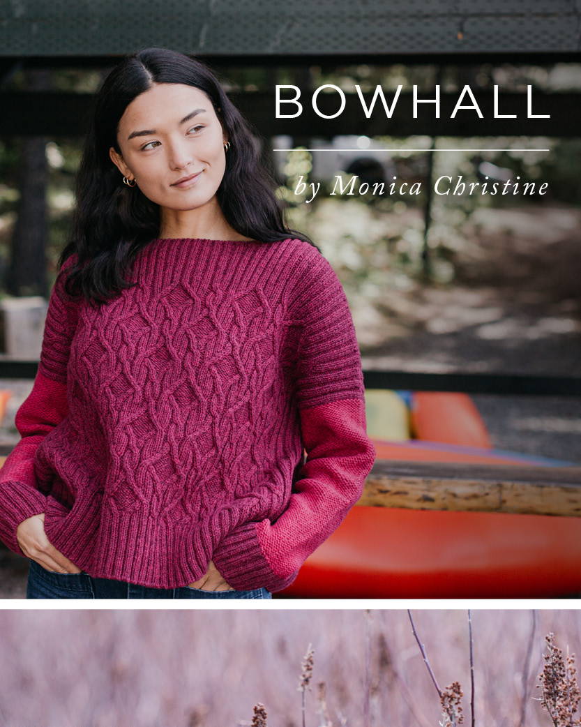 A woman leans agains a rail in front of canoes on a lake shore. She models a cable hand knit sweater - with the title BOWHALL by Monica Christine.