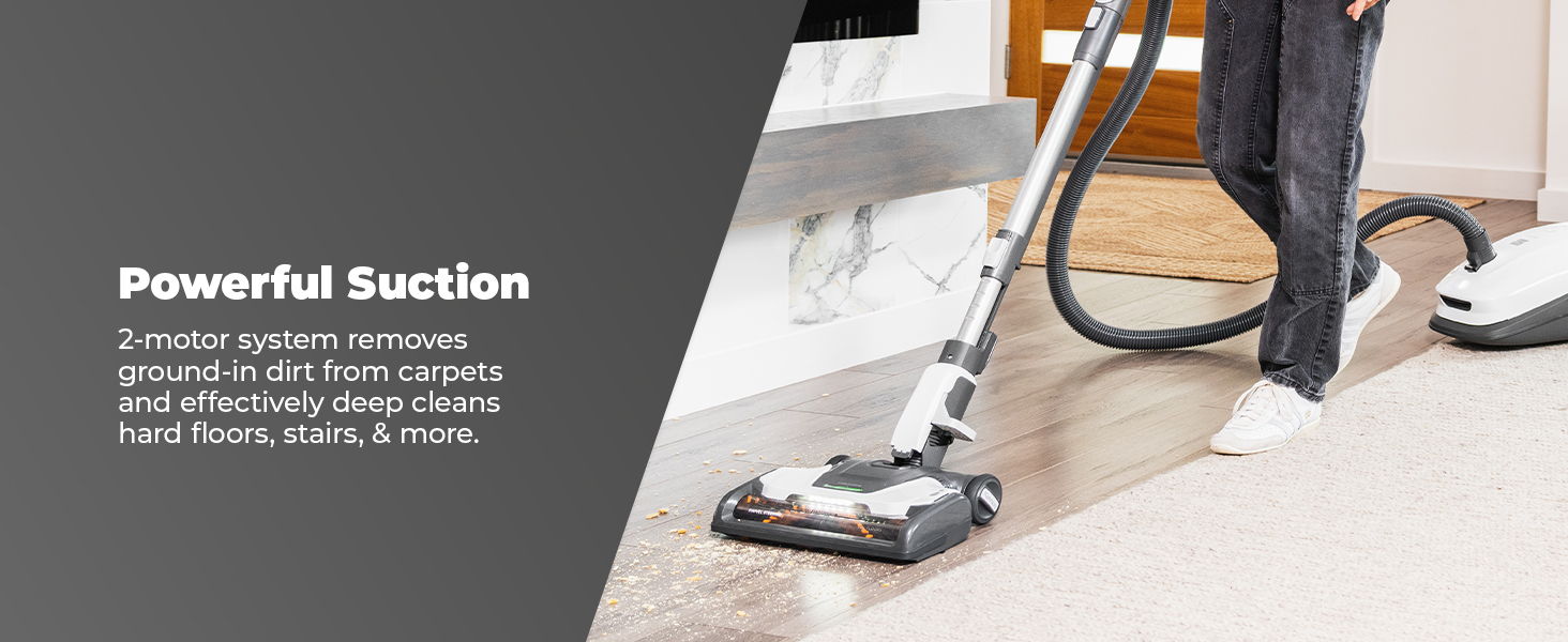 Person vacuuming carpet with a powerful suction vacuum cleaner.