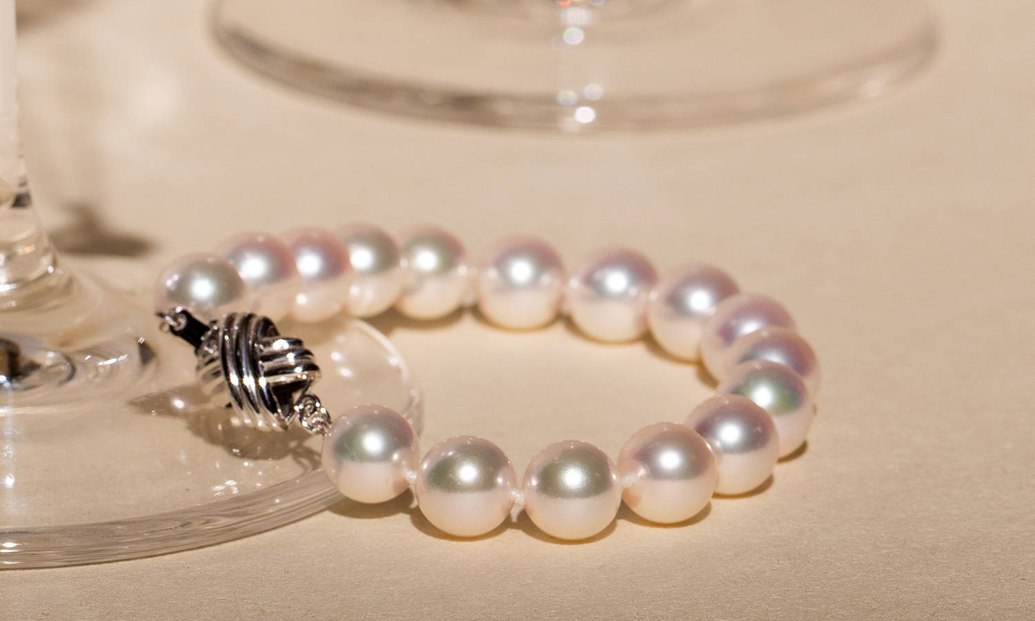 White Pearl Bracelet with White Gold Clasp on Glass