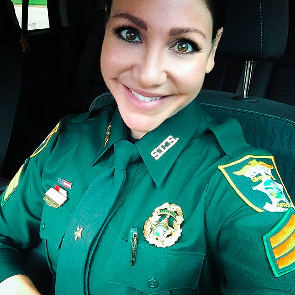 Michelle Paula in uniform, smiling at teh camera.
