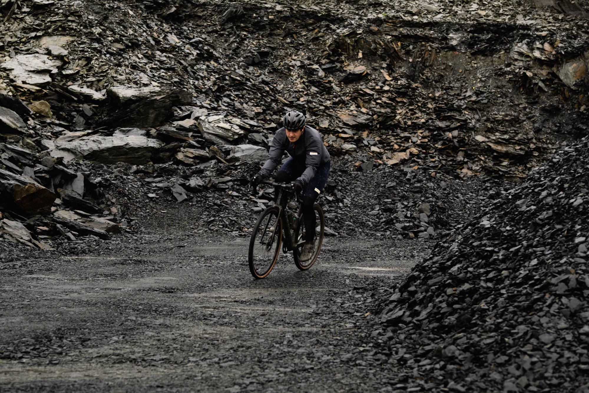 Cyclist riding in heavy gravel
