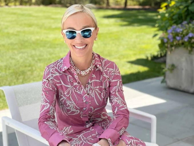 Lisa Frohlic wearing pink cotton shirt dress in the Hamptons by Ala von Auersperg