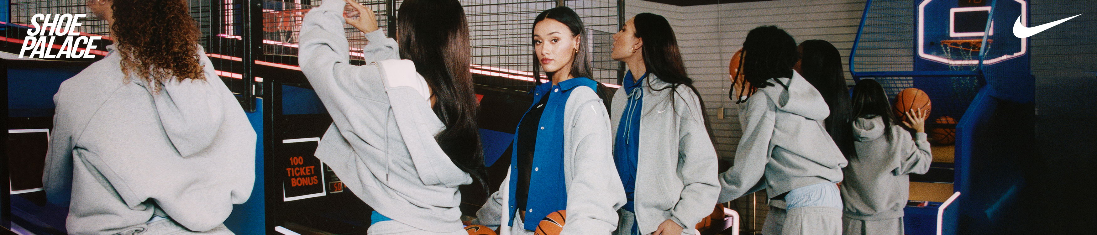 Group of individuals wearing matching outfits in a casual setting.