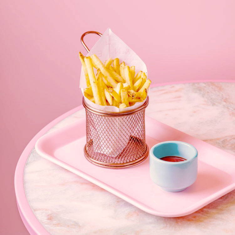 Skinny Fries side served with a pot of sauce