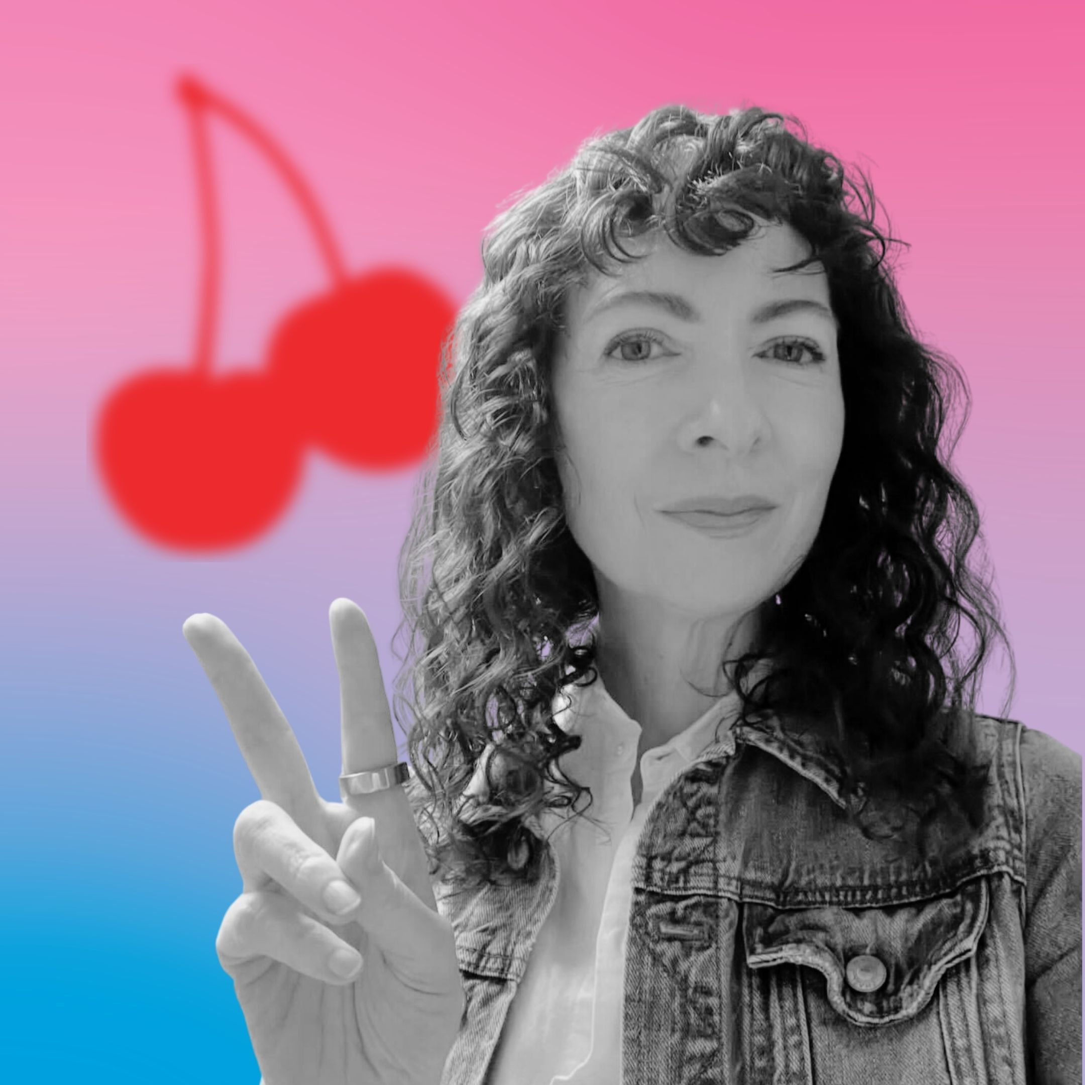 A person making a peace sign with cherries in the background.