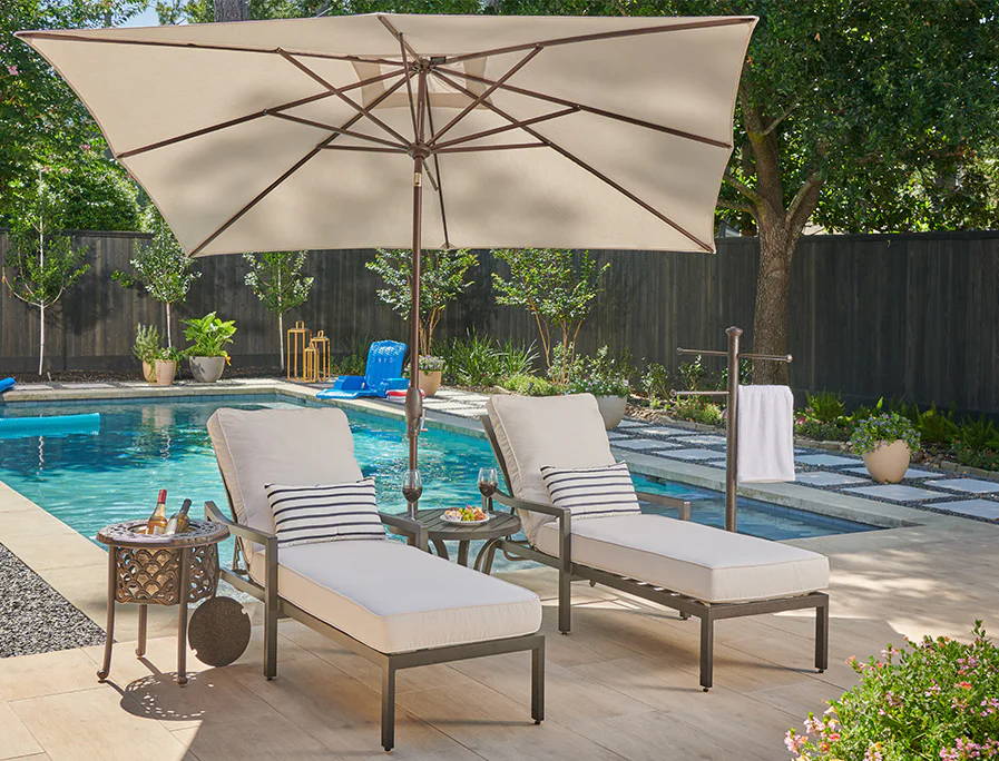 Poolside lounge chairs and a storage box with colorful items.
